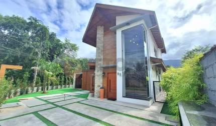 Sobrado com 3 dormitórios à venda, 220 m² por R$ 2.200.000,00 - Massaguaçu - Caraguatatuba/SP