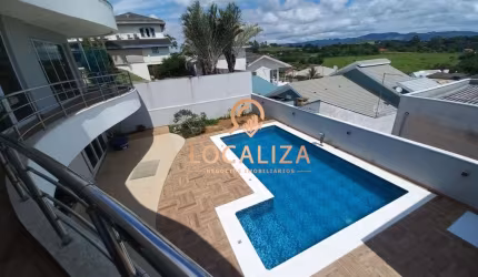 Casa de luxo à venda em Caçapava-SP, Residencial Santa Helena: 4 quartos, 3 suítes, 4 salas, 5 banheiros, garagem para 4 carros.