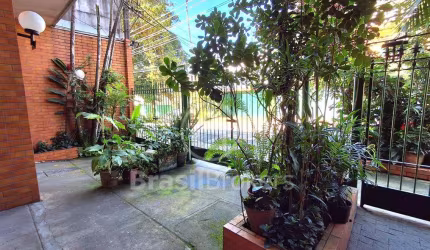 Jardim Botânico quarto e sala com área externa