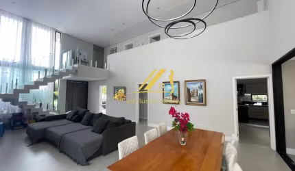 Casa moderna e sofisticada no Alphaville 1. Condomínio Itaparica. 4 suítes, piscina, área gourmet. 400m2 de área construída.