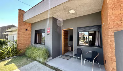 Casa 2 Dormitórios à venda no Bairro CAPÃO NOVO - 1 vaga de garagem