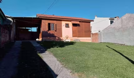 Casa De 3 Dormitórios, Sala De Estar, Banheiro Social, Cozinha, Garagem e Pátio.