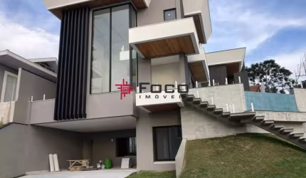 Casa com 4 dormitórios á venda, 477 m2 por R$ 3.600.000,00 - Condomínio Residencial Jaguary -