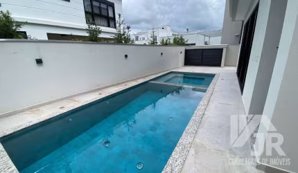 Linda Casa em condominio de alto padrao cpom 3 suites e 3 vagas de garagem