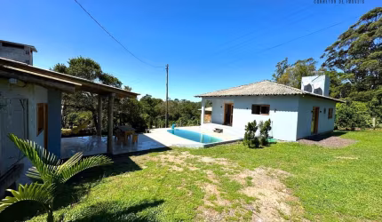 Casa com piscina no bairro Itapeva em Torres