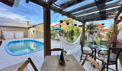 Casa com 5 quartos à venda na Das Rosas, 4176, Capão Novo, Capão da Canoa por R$ 1.000.000
