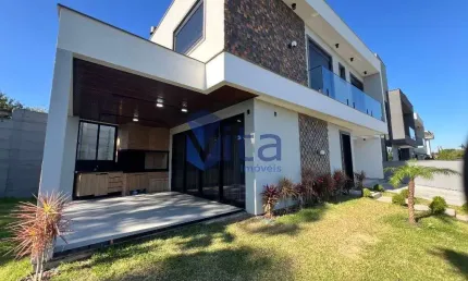 Casa em condomínio fechado com 3 quartos à venda na Rua Leonel Pereira, Cachoeira do Bom Jesus, Florianópolis por R$ 2.198.300