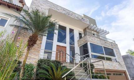 Casa em condomínio fechado com 4 quartos à venda na Rua Tocantins, 540, Agronomia, Porto Alegre por R$ 1.700.000