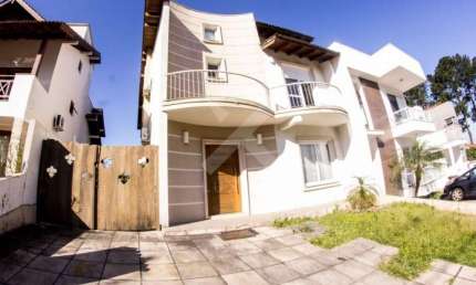 Casa em condomínio fechado com 3 quartos à venda na Avenida Edgar Pires de Castro, 540, Hípica, Porto Alegre por R$ 1.100.000