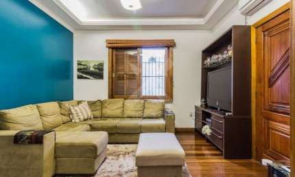 Casa com 5 quartos à venda na Rua Guilherme Schell, 161, Santo Antônio, Porto Alegre por R$ 950.000