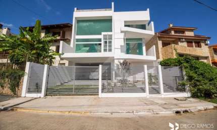 Casa em condomínio fechado com 3 quartos à venda na Rua Alcebíades Antônio dos Santos, 605, Nonoai, Porto Alegre por R$ 1.490.000