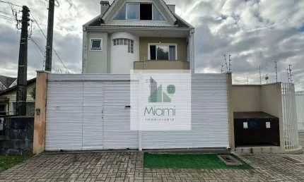 Sobrado com 4 dormitórios à venda, 153 m² por R$ 690.000,00 - Uberaba - Curitiba/PR