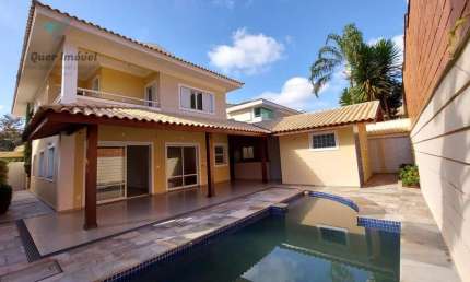 Luxuosa casa de alto padrão no Condomínio Manacás, Jardim Botânico, Ribeirão Preto-SP. 4 suítes, 516m², 6 vagas. Quer Imóvel Negócios Imobiliários.