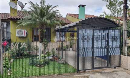 Casa em condomínio fechado com 2 quartos à venda na Rua Capitão Pedroso, 769, Restinga, Porto Alegre, 109 m2 por R$ 210.000