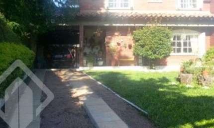 Casa em condomínio fechado com 3 quartos à venda na Rua dos Guenoas, 796, Guarujá, Porto Alegre, 300 m2 por R$ 1.080.000