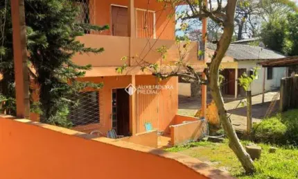 Casa com 4 quartos à venda na Avenida Vicente Monteggia, 283, Cavalhada, Porto Alegre, 200 m2 por R$ 640.000