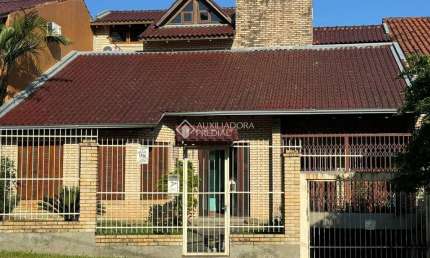 Casa com 3 quartos à venda na Rua Alcebíades Antônio dos Santos, 107, Nonoai, Porto Alegre, 423 m2 por R$ 990.000
