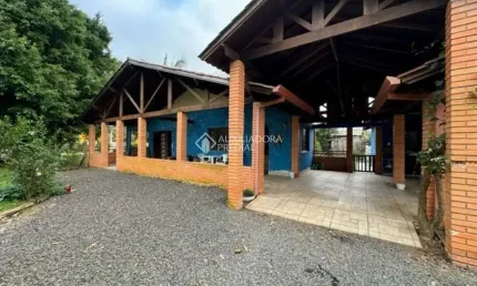 Casa em condomínio fechado com 3 quartos à venda na Rua Sol Nascente, 78, Águas Claras, Viamão, 146 m2 por R$ 590.000