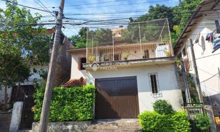 Casa com 3 quartos à venda na Rua Santiago Dantas, 398, Cascata, Porto Alegre, 160 m2 por R$ 299.000