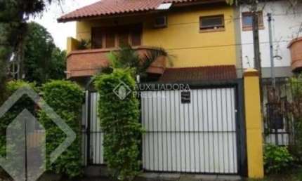 Casa em condomínio fechado com 3 quartos à venda na Rua Mura, 120, Guarujá, Porto Alegre, 154 m2 por R$ 600.000