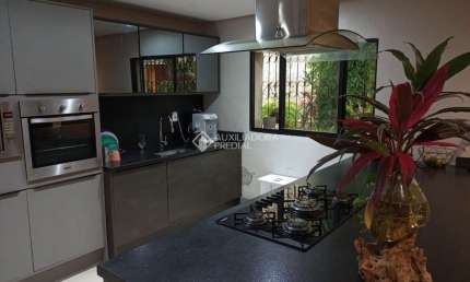 Casa com 4 quartos à venda na Rua Alfredo Schuett, 320, Três Figueiras, Porto Alegre, 296 m2 por R$ 2.499.900