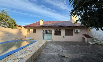 Casa em condomínio fechado com 3 quartos à venda na Rua Chile, 661, Jardim Universitário, Viamão, 160 m2 por R$ 530.000