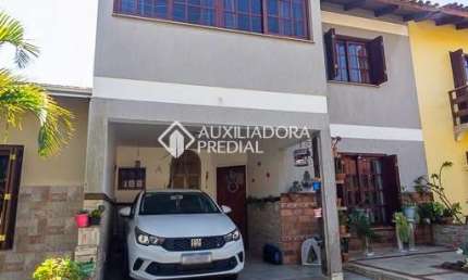 Casa em condomínio fechado com 3 quartos à venda na Rua Ponciano Pacheco da Silveira, 172, Guarujá, Porto Alegre, 167 m2 por R$ 470.000