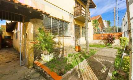 Casa em condomínio fechado com 3 quartos à venda na Avenida Luiz Moschetti, 510, Vila João Pessoa, Porto Alegre, 280 m2 por R$ 649.000