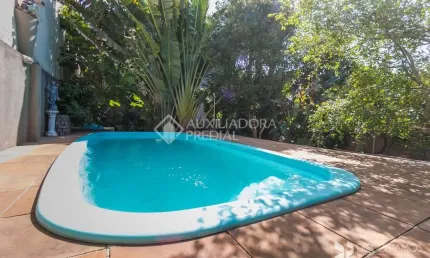 Casa em condomínio fechado com 3 quartos à venda na Rua Márcio Dias, 196, Nonoai, Porto Alegre, 214 m2 por R$ 850.000