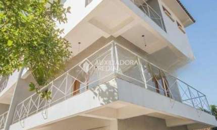 Casa em condomínio fechado com 3 quartos à venda na Rua Jamil Antônio José, 46, Nonoai, Porto Alegre, 195 m2 por R$ 650.000