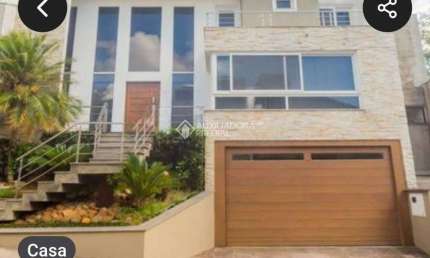 Casa em condomínio fechado com 3 quartos à venda na Rua Tocantins, 937, Lomba do Pinheiro, Porto Alegre, 397 m2 por R$ 1.750.000