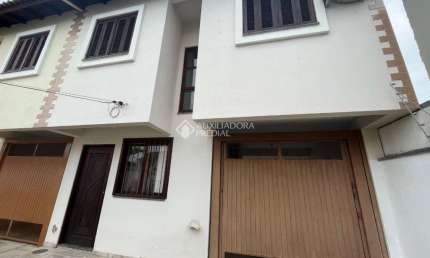 Casa em condomínio fechado com 3 quartos à venda na Rua Adão da Silva Santos, 230, São José, Canoas, 112 m2 por R$ 500.000