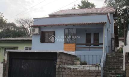 Casa em condomínio fechado com 3 quartos à venda na Avenida Cruz Alta, 188, Nonoai, Porto Alegre, 253 m2 por R$ 850.000