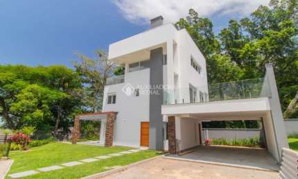 Casa em condomínio fechado com 3 quartos para alugar na Avenida Coronel Marcos, 1239, Pedra Redonda, Porto Alegre, 335 m2 por R$ 29.900