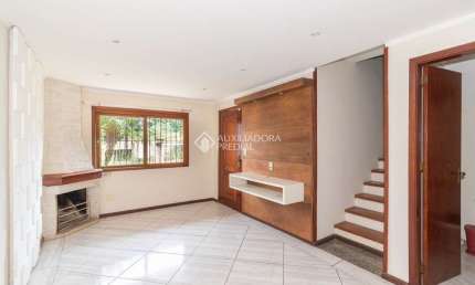 Casa em condomínio fechado com 3 quartos para alugar na Rua Doutor Lauro Miguel Sturm, 217, Hípica, Porto Alegre, 118 m2 por R$ 3.500