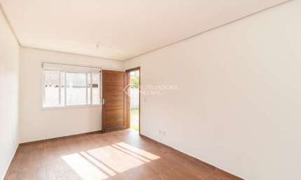 Casa em condomínio fechado com 2 quartos para alugar na Rua Santa Mônica, 404, Ponta Grossa, Porto Alegre, 60 m2 por R$ 1.200