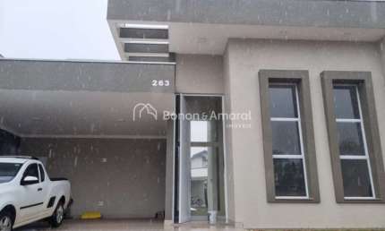 Casa à venda em condomínio, em Paulínia, 3 suites, closet, lavabo, escritório, 4 vagas, aquecimento solar, piscina com cascata,fino acabamento.
