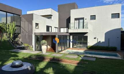 Casa com 5 suítes em condomínio à venda, 507 m² por R$ 5.500.000 - Chácaras Aeroporto - Maringá/PR