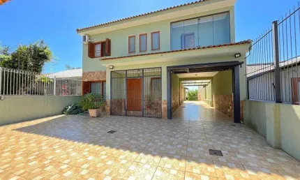 Casa com 6 dormitórios à venda, 344 m² por R$ 1.350.000,00 - Tristeza - Porto Al