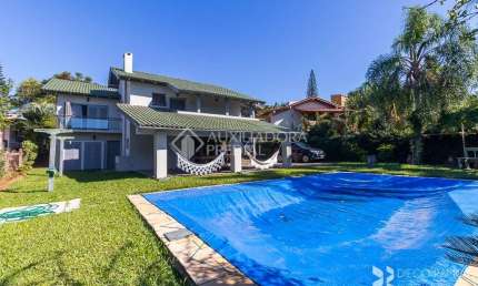 Casa em condomínio fechado com 3 quartos à venda na Avenida Firmino Octávio Bimbi, 255, Cavalhada, Porto Alegre, 400 m2 por R$ 1.999.000