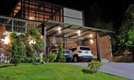 Casa em condomínio fechado com 3 quartos à venda na Avenida Senador Salgado Filho, 8500, Jardim Krahe, Viamão, 357 m2 por R$ 1.200.000