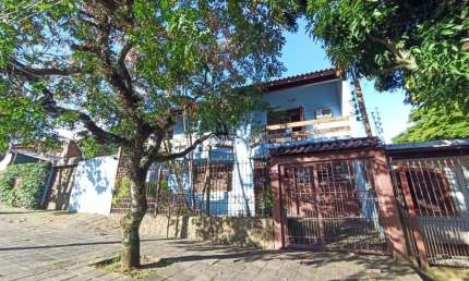 Casa com 4 quartos à venda na Avenida Cruz Alta, 110, Nonoai, Porto Alegre, 419 m2 por R$ 2.000.000