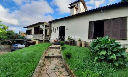 Casa em condomínio fechado com 5 quartos à venda na Rua São Cristiano, 67, Santa Tereza, Porto Alegre, 399 m2 por R$ 750.000