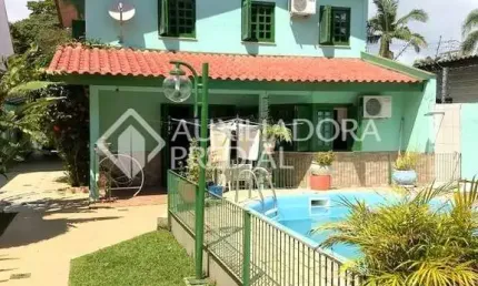 Casa em condomínio fechado com 4 quartos à venda na Rua Mura, 50, Guarujá, Porto Alegre, 297 m2 por R$ 750.000