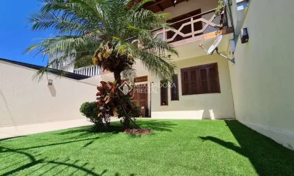 Casa com 3 quartos à venda na Rua Dos Quero Queros, 576, Jardim Algarve, Alvorada, 170 m2 por R$ 790.000