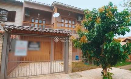 Casa com 5 quartos à venda na Rua Anhumas, 42, Jardim Algarve, Alvorada, 200 m2 por R$ 499.000