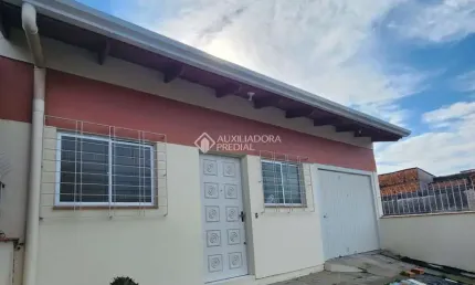 Casa com 3 quartos à venda na Quarenta e Três, 53, Jardim Algarve, Alvorada, 123 m2 por R$ 349.900