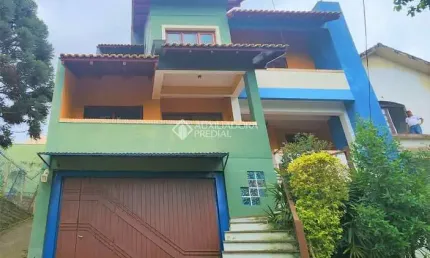 Casa com 3 quartos à venda na Rua Theonila Carvalho da Motta, 80, Parque Santa Fé, Porto Alegre, 438 m2 por R$ 1.150.000