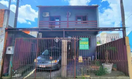 Casa com 2 quartos à venda na Rua Caturritas, 927, Jardim Algarve, Alvorada, 102 m2 por R$ 450.000