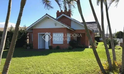 Casa em condomínio fechado com 4 quartos à venda na Rua Miraguaia, 159, Centro, Xangri-Lá, 284 m2 por R$ 980.000
